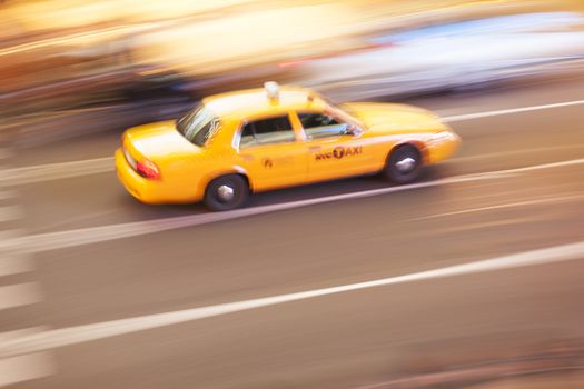 Yellow Taxi Cabin in motion, in Times Square, New York City, New York, USA.