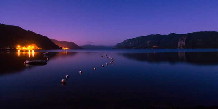 The beautiful norwegian coastline around Kristiansand in Scandinavia at night

