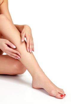 Woman's legs on white background, isolated