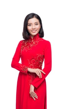 Charming Vietnamese Woman in Ao Dai Traditional Dress isolated on white.