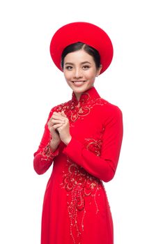 Charming Vietnamese Bride in Red Ao Dai Traditional Dress with hat.