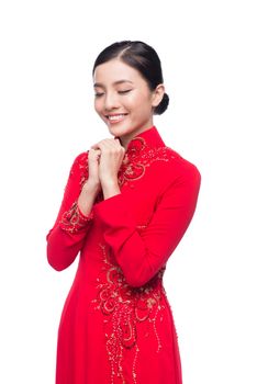 Charming Vietnamese Woman in Ao Dai Traditional Dress, Gesture to Pray or Wishing.