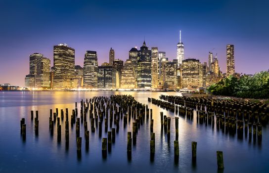 New York City - beautiful sunrise over manhattan with manhattan and brooklyn bridge USA