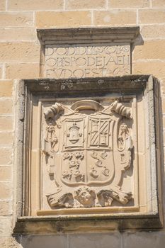 Stone shield on the main facade of the Hospital de Santiago, Ubeda, Jaen, Spain