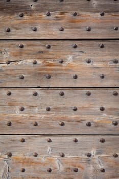 Detail of a 200 years old Italian door, made of wood.  Background use.