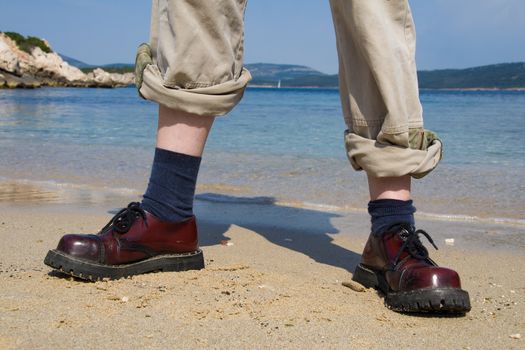 Girls boots near the sea