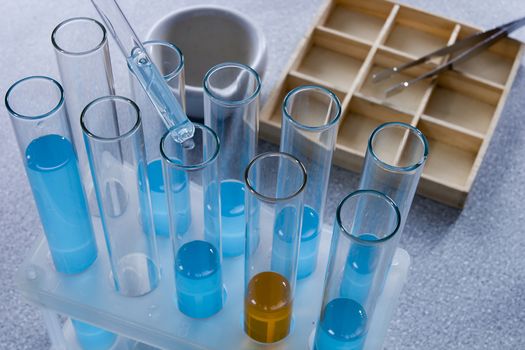 Close up of test tubes with liquids in the laboratory