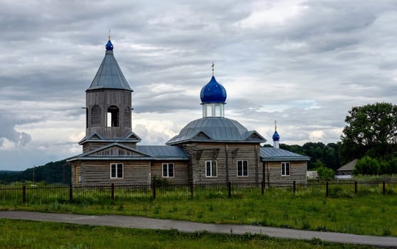 Old wooden orthodox Snt Alexander Nevsky church in the Siberian village Krasnoselka
