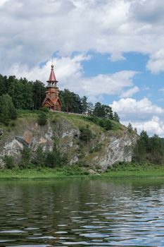 Beautifull wooden christian orthodox church on the bank of the river. Sts Kirill and Methodius chapel at Tomskaya pisanitsa. Siberia. Taiga.