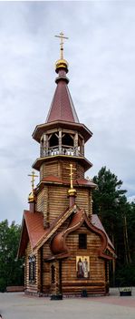 Beautiful wooden christian orthodox church of Sts Kirill and Methodius chapel at Tomskaya pisanitsa. Siberia. Taiga.