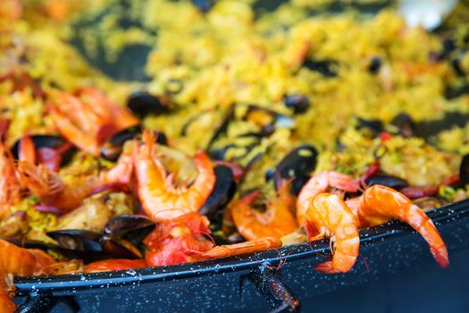 Close-up of Paella with pink prawns and other seafood