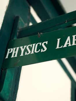 COLOR PHOTO OF BOARD WITH 'PHYSICS LAB' SIGN