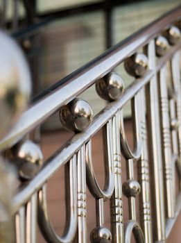 COLOR PHOTO OF HANDRAIL MADE FROM STAINLESS STEEL