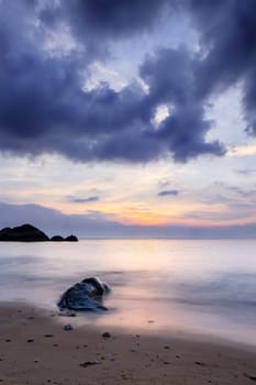 Long exposure sunset at exotic tropical island. Sand, stone and rocks. Tioman, Malaysia
