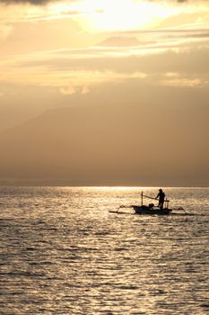 Fisherman in the morning near Rinjani volcano, lombok, indonesia