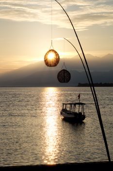 Boat at dawn. Lombok view from Gili Meno;