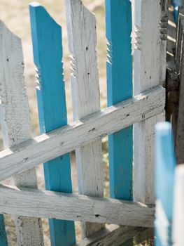 COLOR PHOTO OF OLD WOODEN FENCE IN DAYTIME