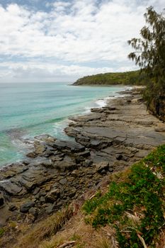 Sea sky and stones at Tea Tree Bay Noosa Parc. Australia