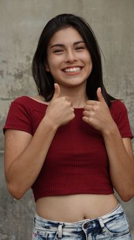 Female Teen Thumbs Up