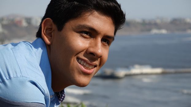 Smiling Teen Boy At Ocean