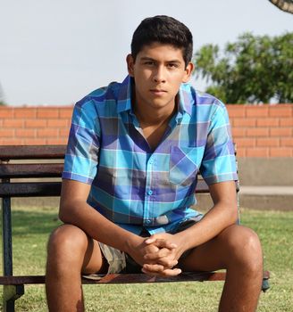 Teen Hispanic Boy Sitting
