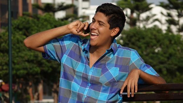 Happy Teen Boy Talking On Cell Phone