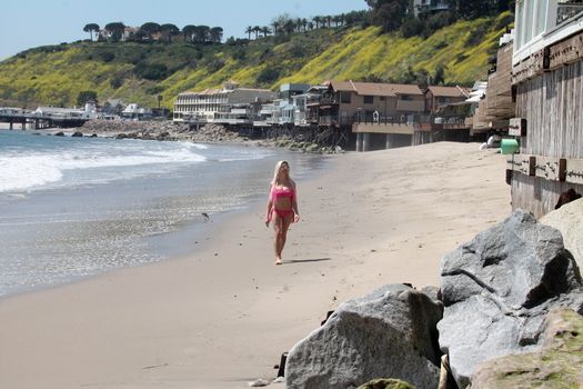 Frenchy Morgan the "Celebrity Big Brother" Star is spotted doing yoga and karate on the beach while wearing a tiny pink bikini, Malibu, CA 04-21-17