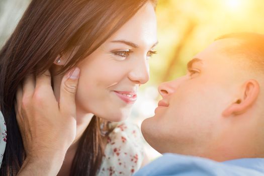 Happy Mixed Race Romantic Couple Portrait in the Park.