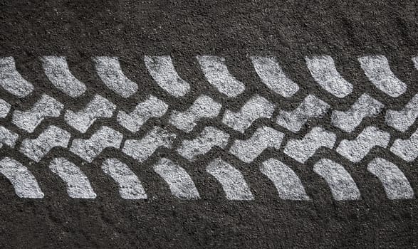 Detail Of A White Painted Tyre Track On Black Asphalt