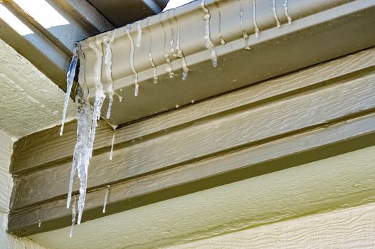 Icicles hanging off a roof.