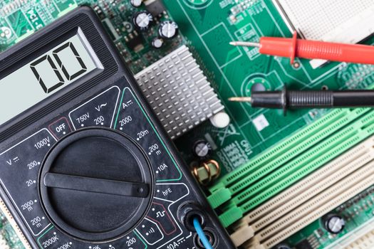 Electronic measuring tool close-up on a computer board