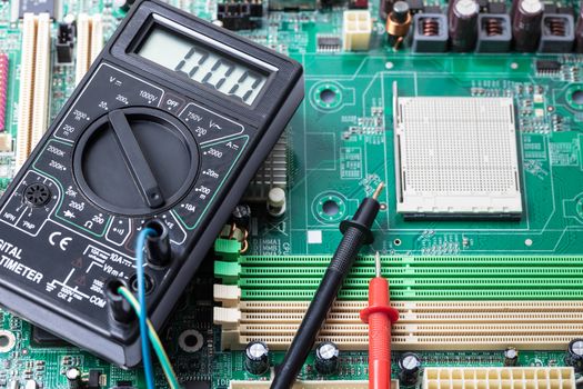 Electronic measuring tool close-up on a computer board