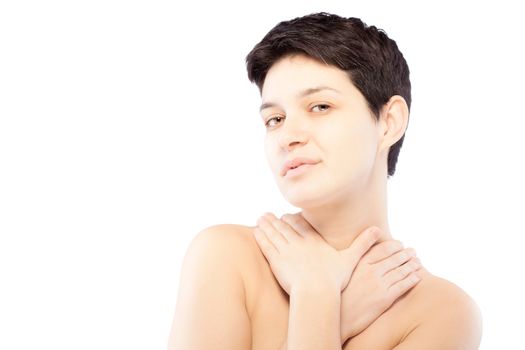 girl with a short hair touching her neck and looking at camera