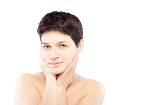 girl with a short hair touching her face and looking at camera