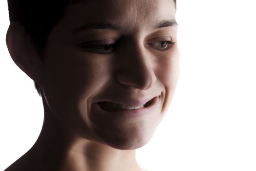 portrait of a girl with a short hair looking at camera, making strange expression