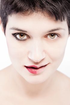 girl with a short hair, having half her face with make up, happy expression