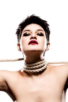 girl with short hair, having rope around her neck, looking at camera from above