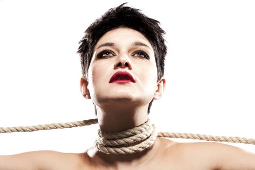 girl with short hair, having rope around her neck, looking up