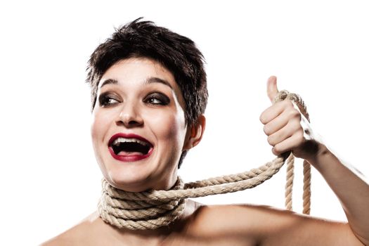 happy girl with short hair, having rope around her neck, making thumbs up gesture