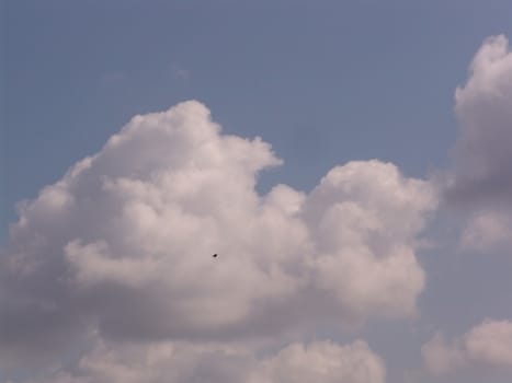 Blue sky with clouds and sun