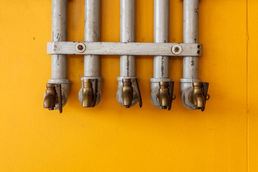 Oil Pipes with Yellow Background.