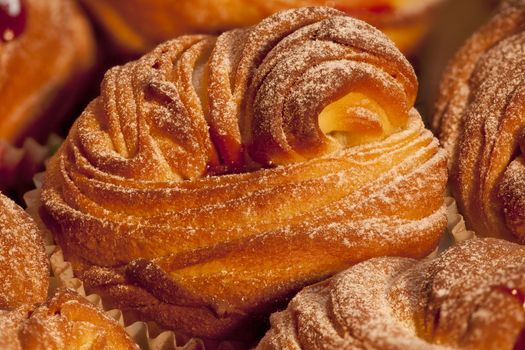 American cruffins with jam Sprinkled with powdered sugar background