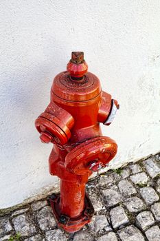 A closeup red fire hydrant on a street