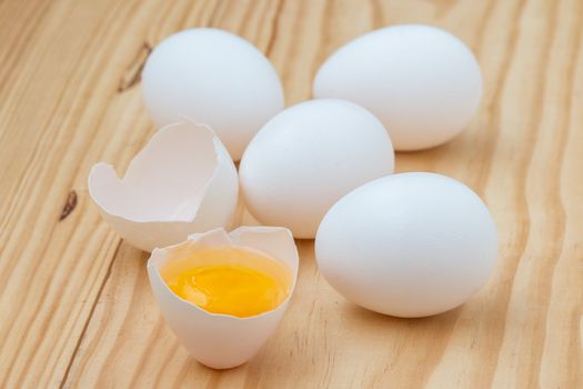 Eggs on wooden background.