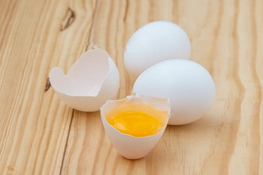 Eggs on wooden background.