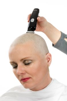 Portrait of beautiful middle age woman sad patient with cancer shaving heads isolated on white background, hope in healing. She lost her hair