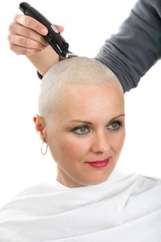 Portrait of beautiful middle age woman patient with cancer shaving heads isolated on white background, hope in healing. She lost her hair