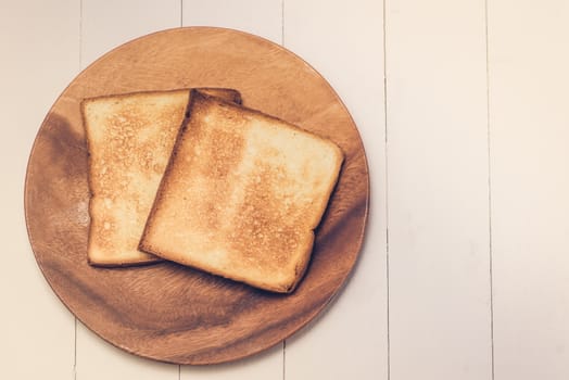 Slice of toast bread on wood table