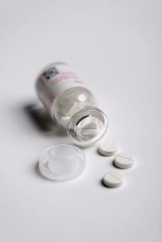 Pills and medicine over a white board