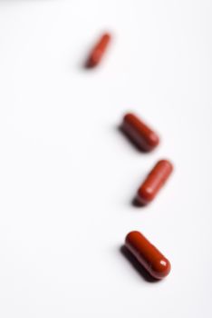 Pills and medicine over a white board